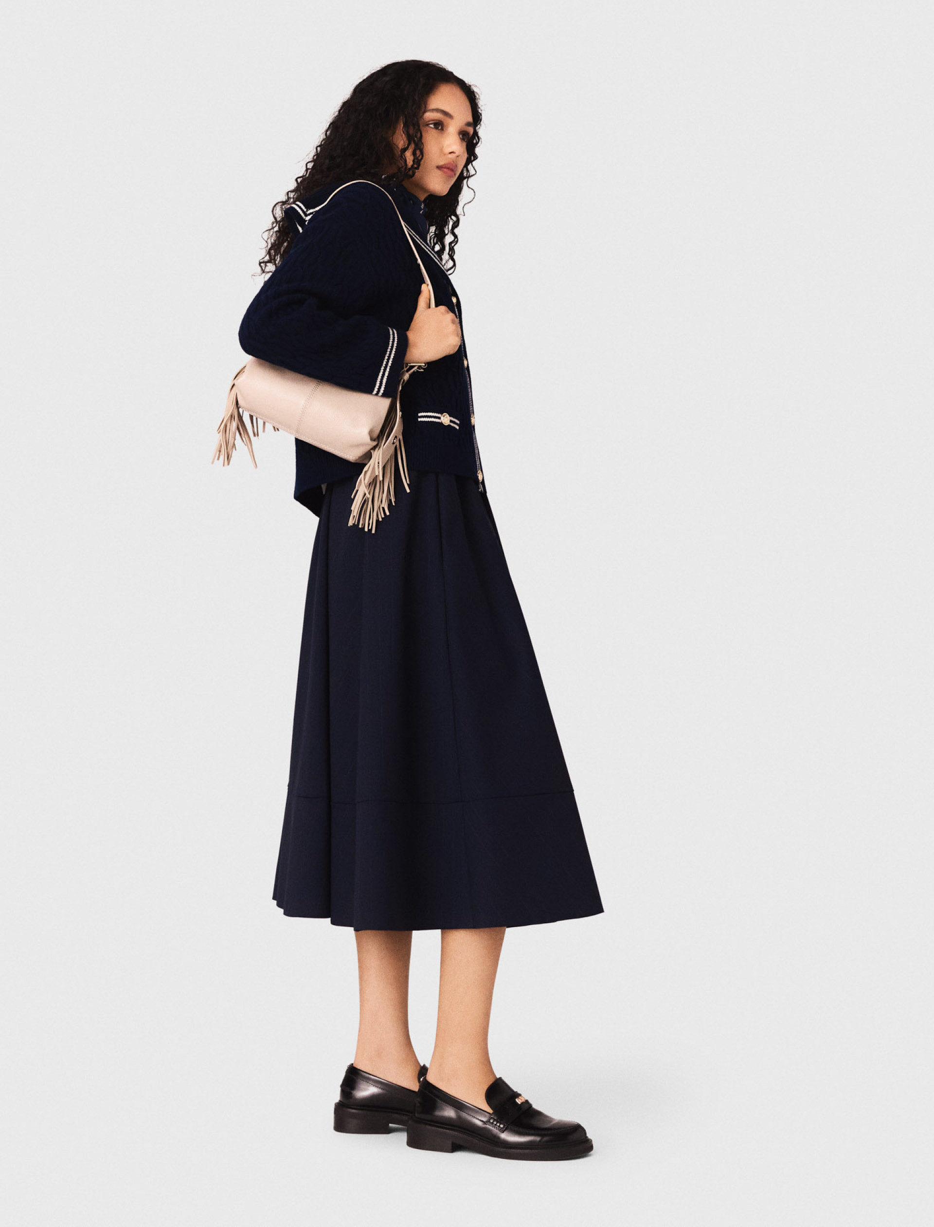 Жіноча синя спідниця у смужку середньої довжини Жіноча синя спідниця у смужку середньої довжини