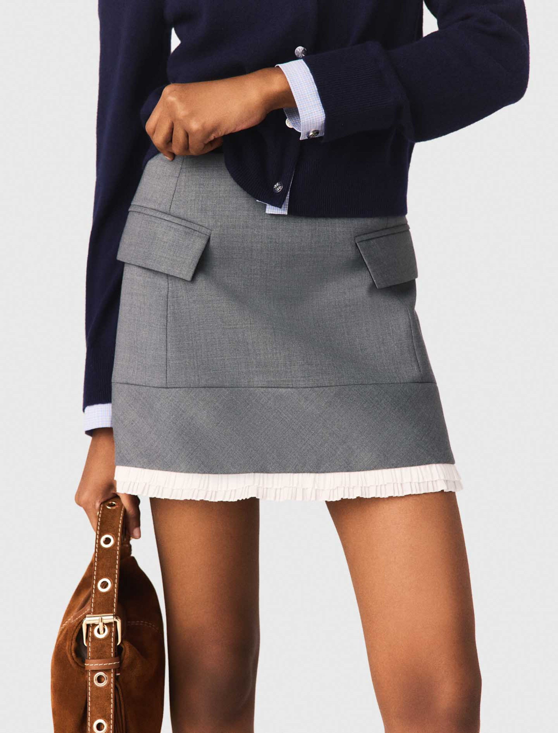 Жіноча міні спідниця А-силуету з кишенями Жіноча міні спідниця А-силуету з кишенями