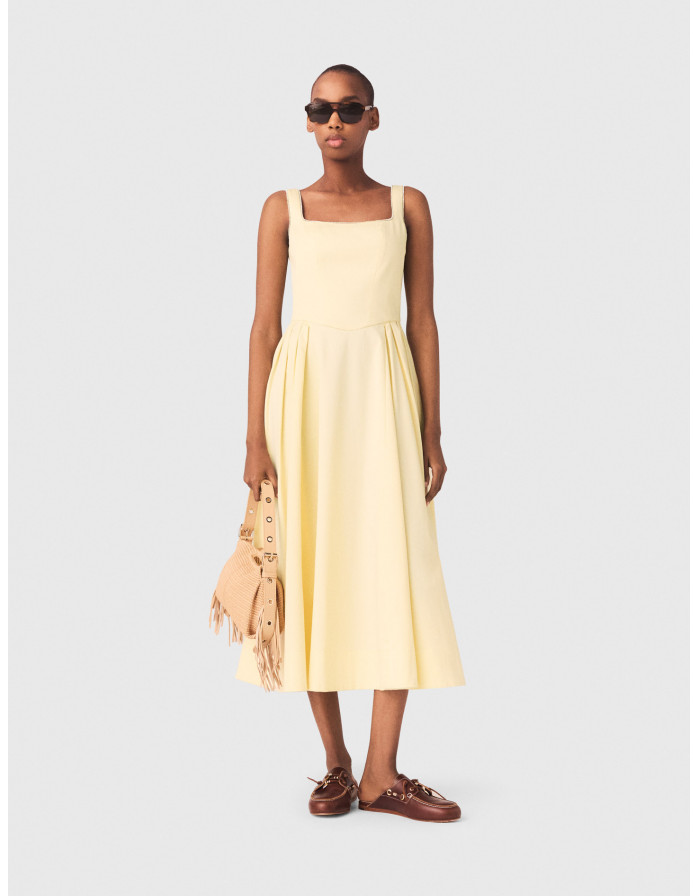 Жіноча жовта сукня міді з оздобленням стразами