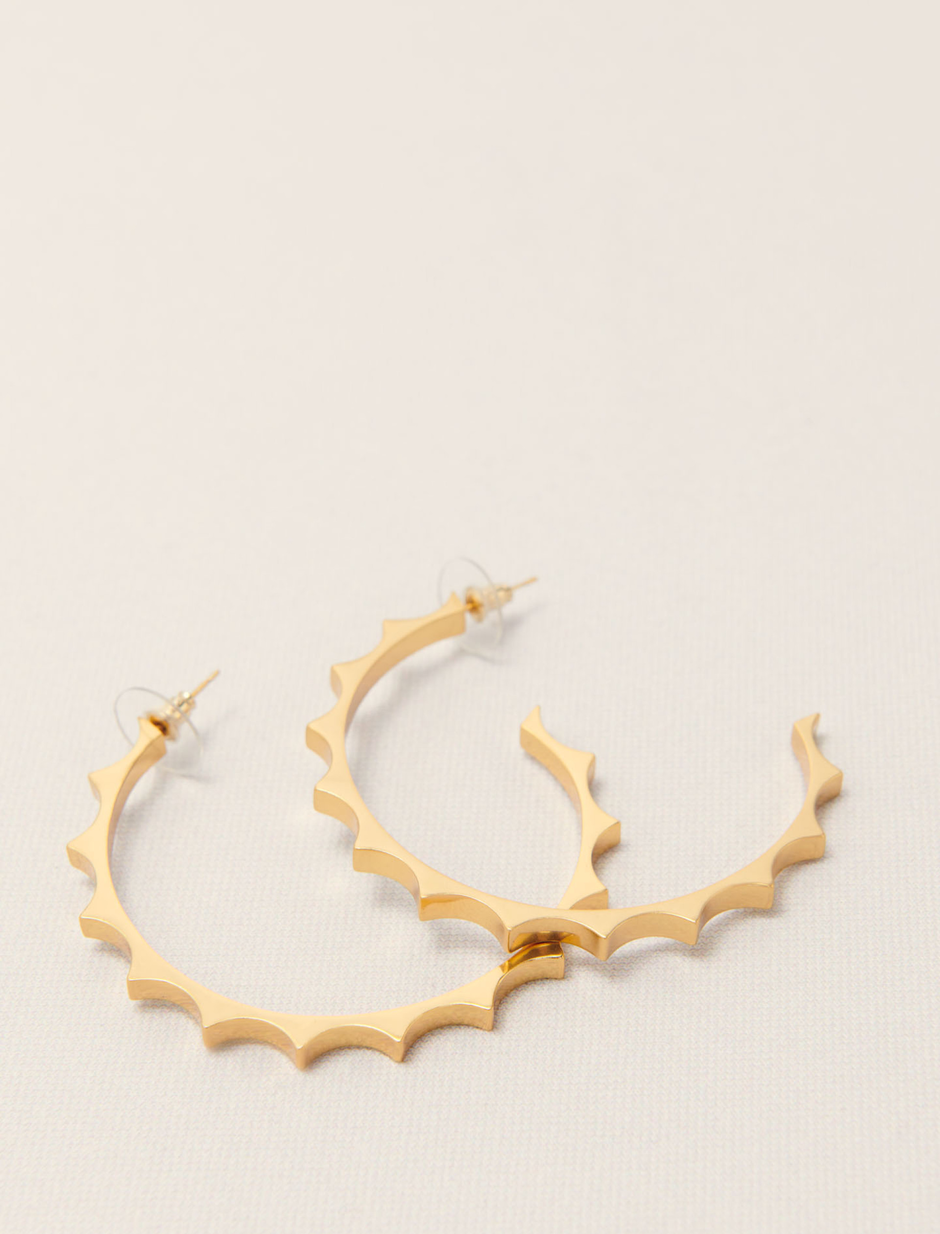 Жіночі золотисті сережки-кільця Жіночі золотисті сережки-кільця