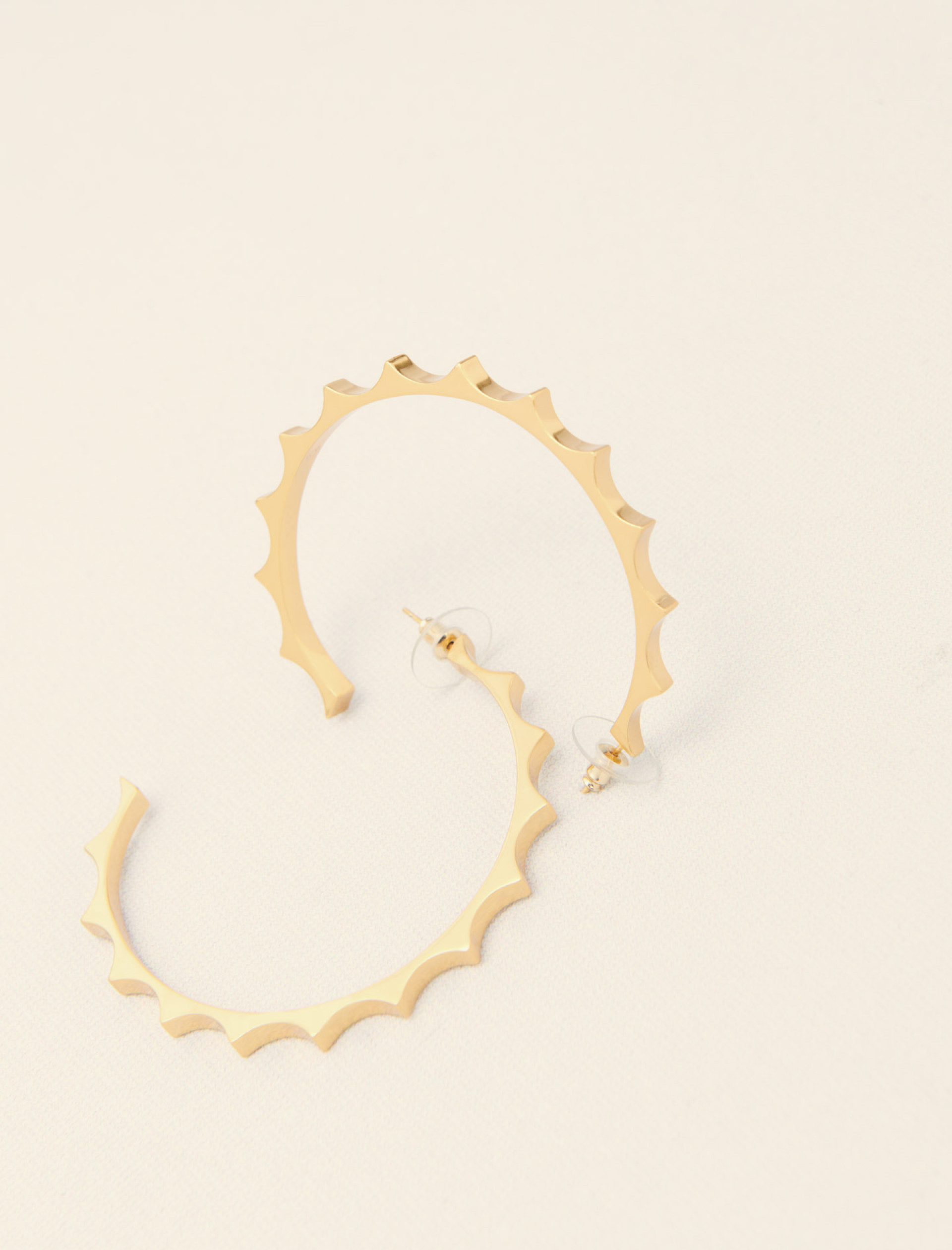 Жіночі золотисті сережки-кільця Жіночі золотисті сережки-кільця