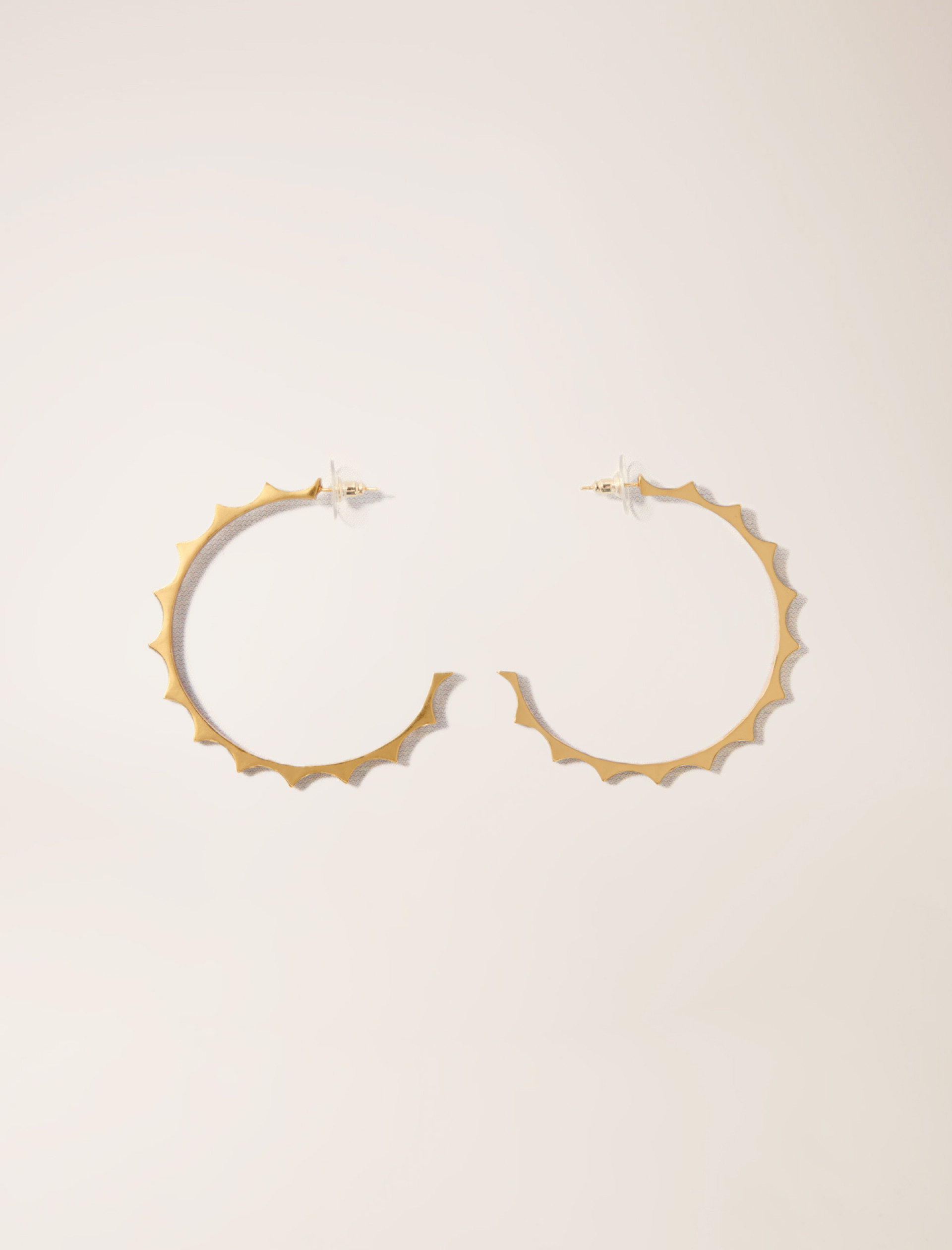 Жіночі золотисті сережки-кільця Жіночі золотисті сережки-кільця