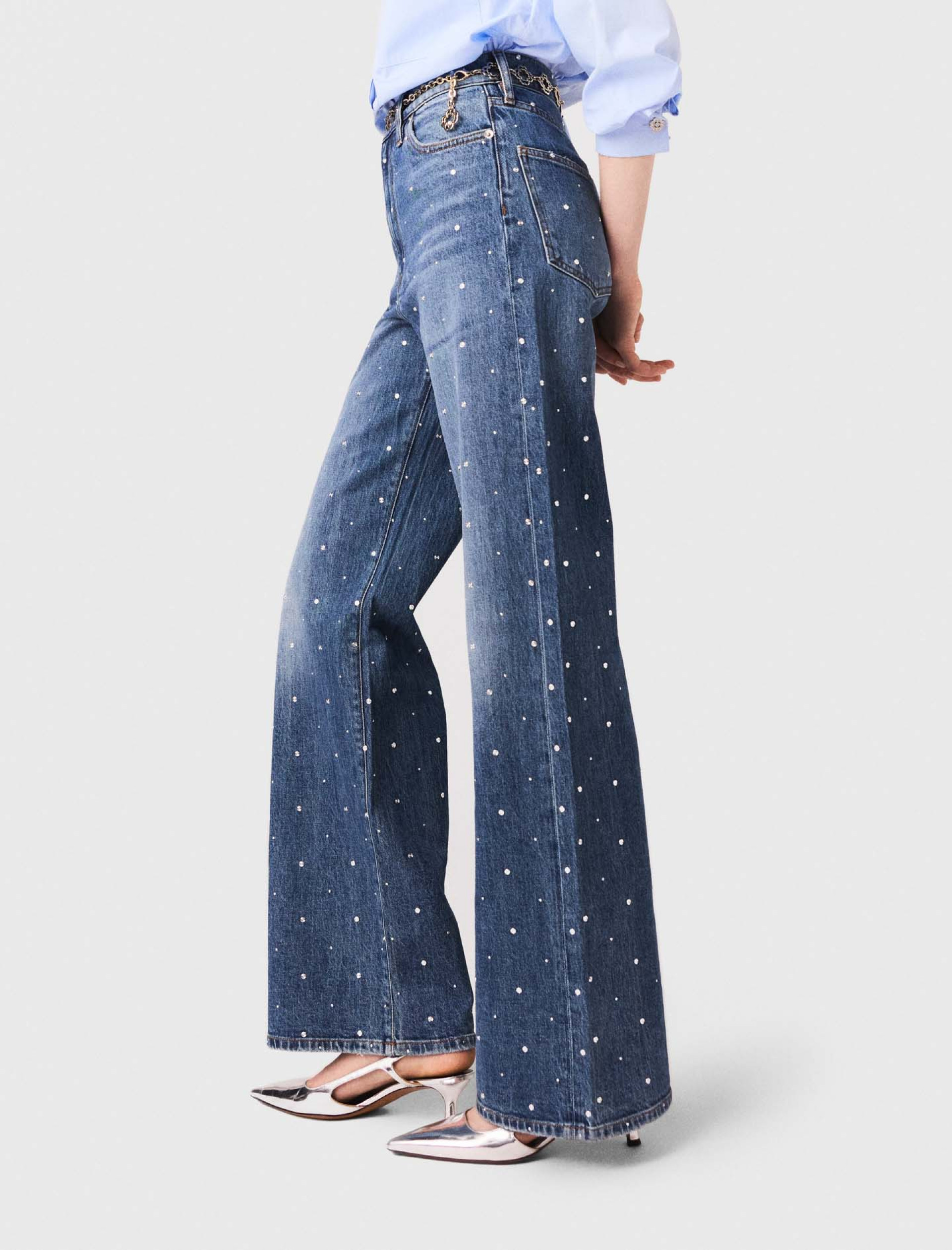 Жіночі широкі джинси з заклепками