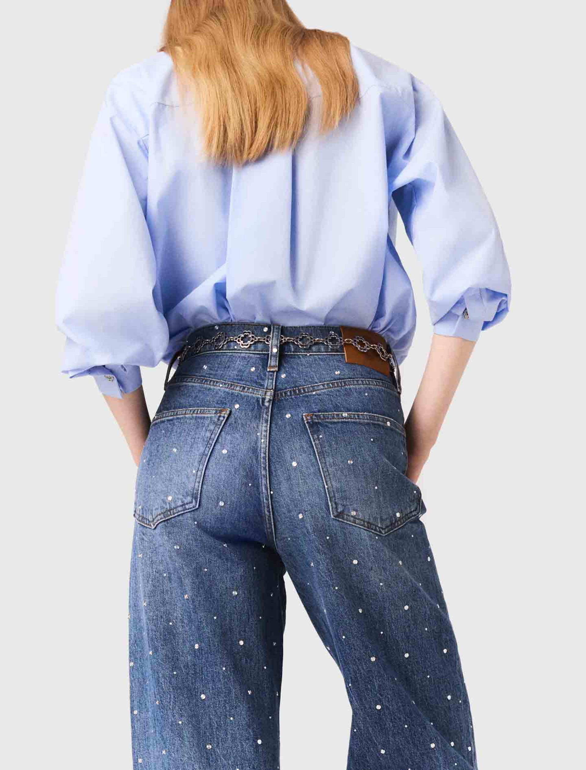 Жіночі широкі джинси з заклепками