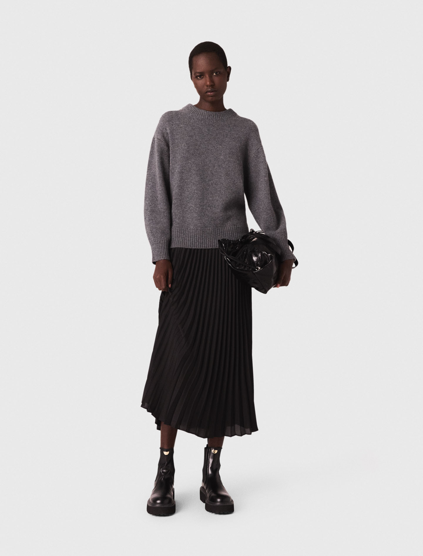 Жіноча сукня-светр з плісированою спідницею