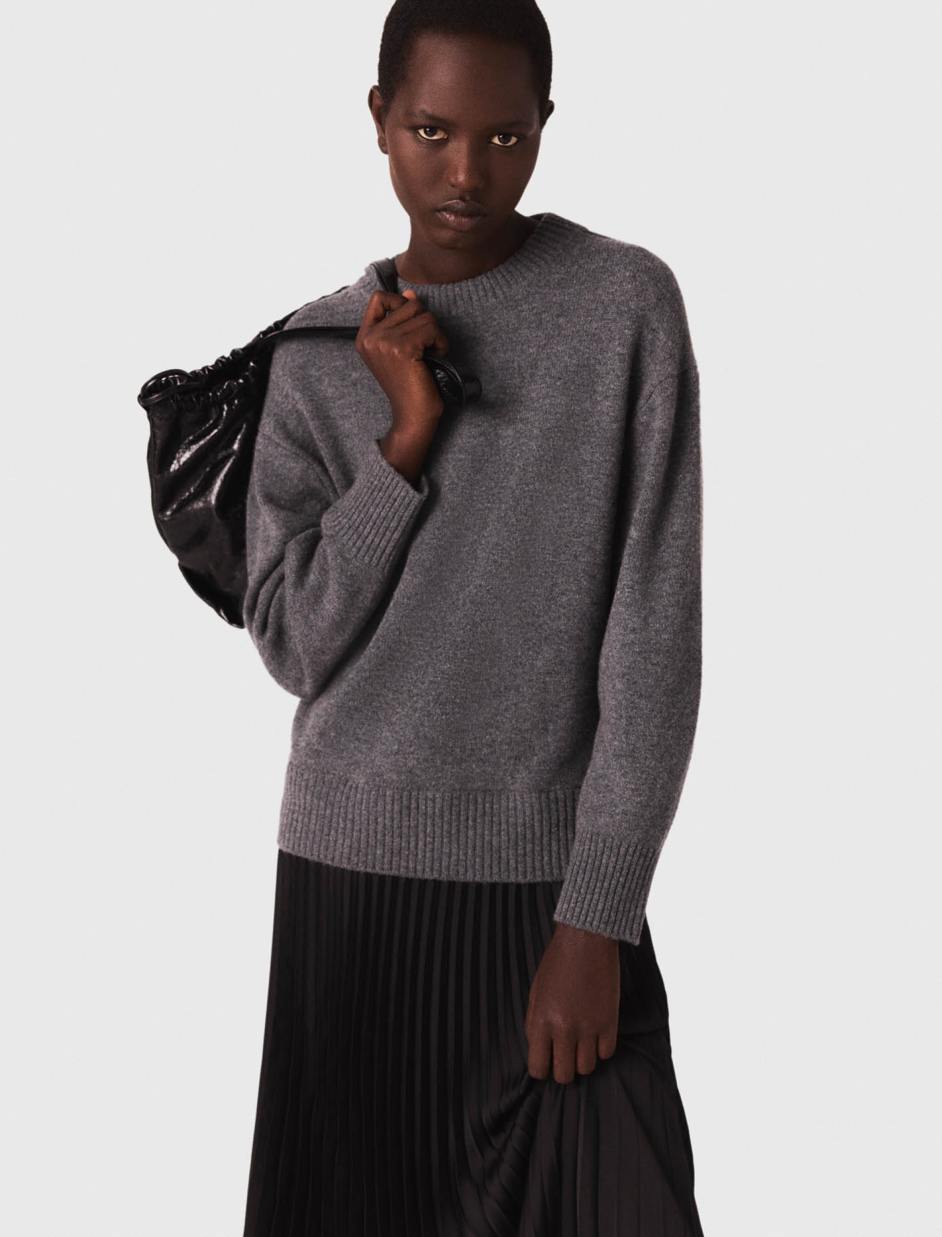 Жіноча сукня-светр з плісированою спідницею