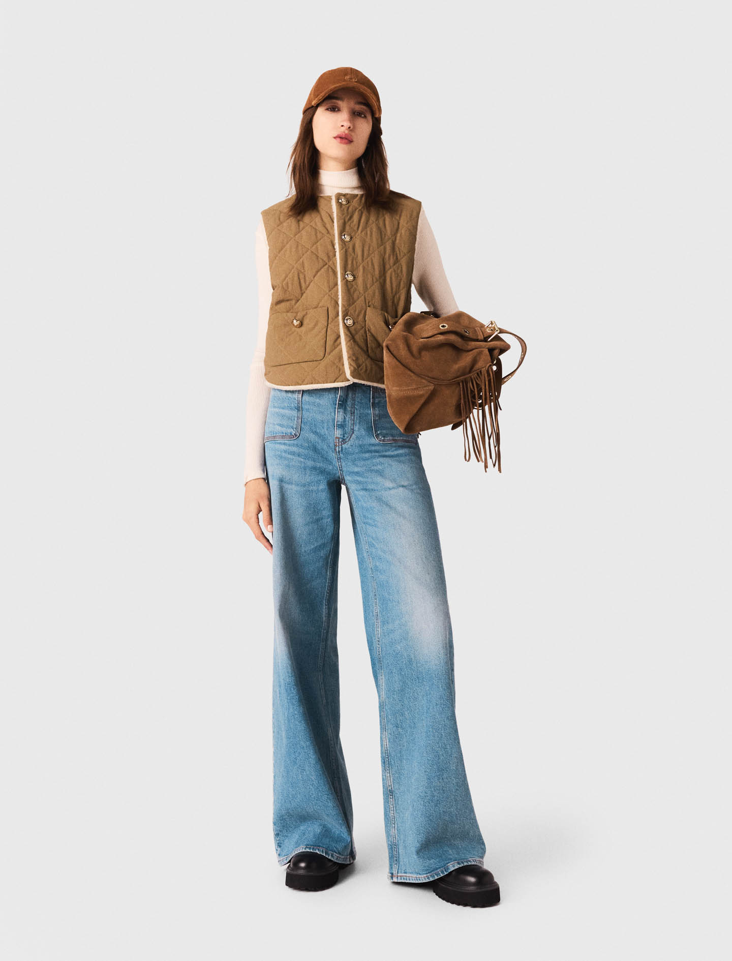 Жіночий двосторонній стьоганий жилет