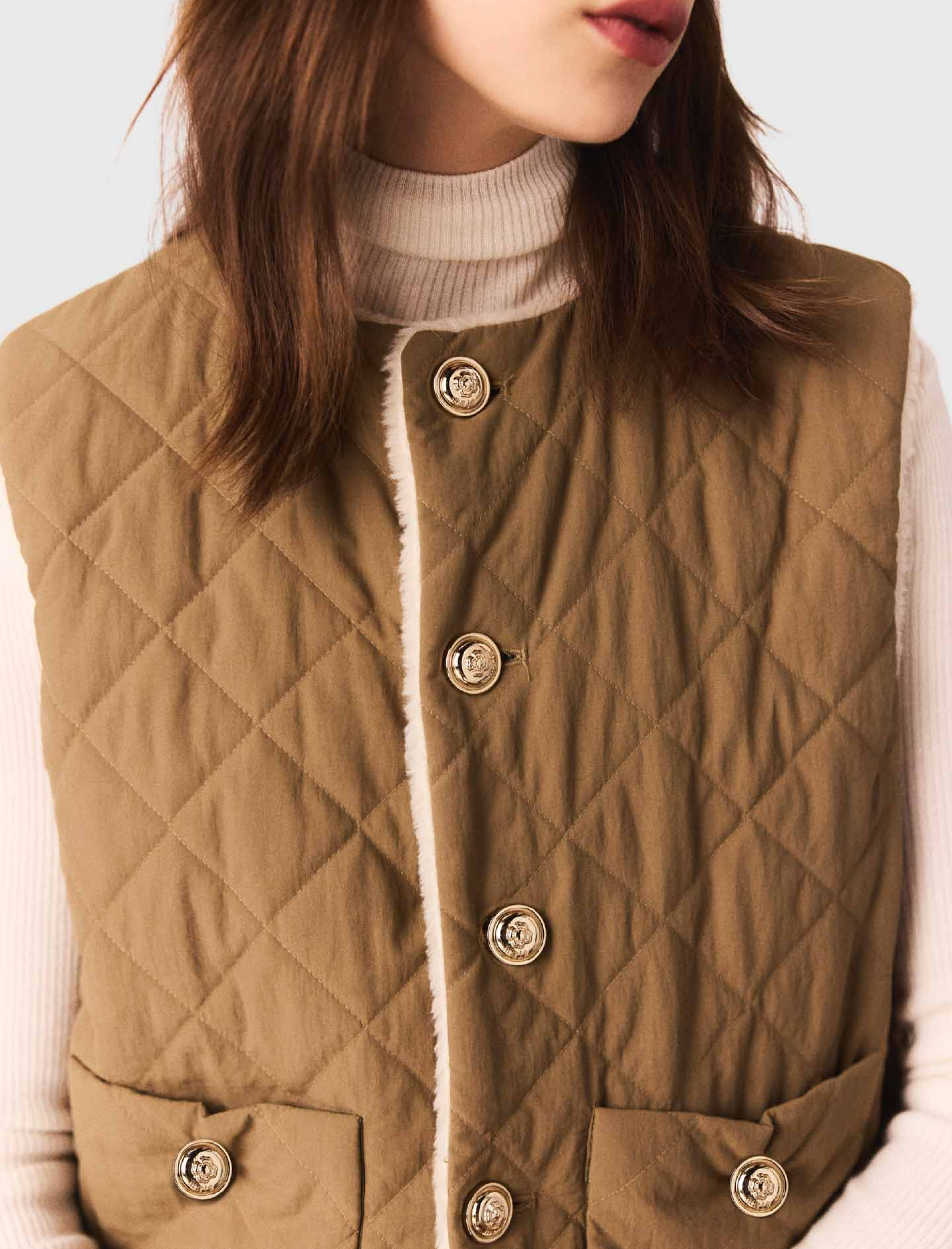 Жіночий двосторонній стьоганий жилет