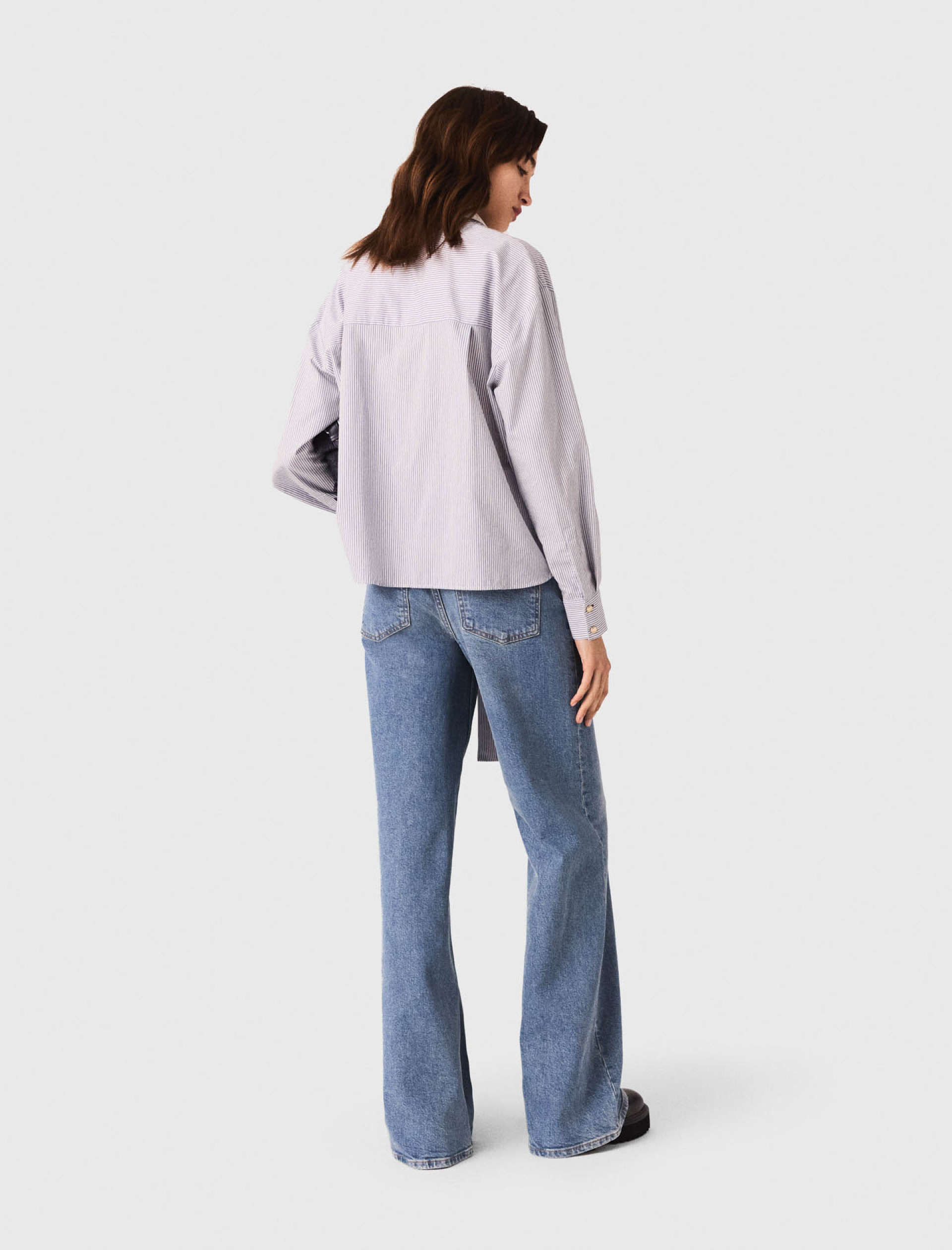 Женская полосатая рубашка с бантом