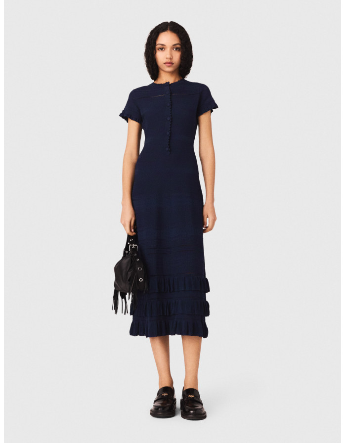 Жіноча довга в'язана сукня з оборками