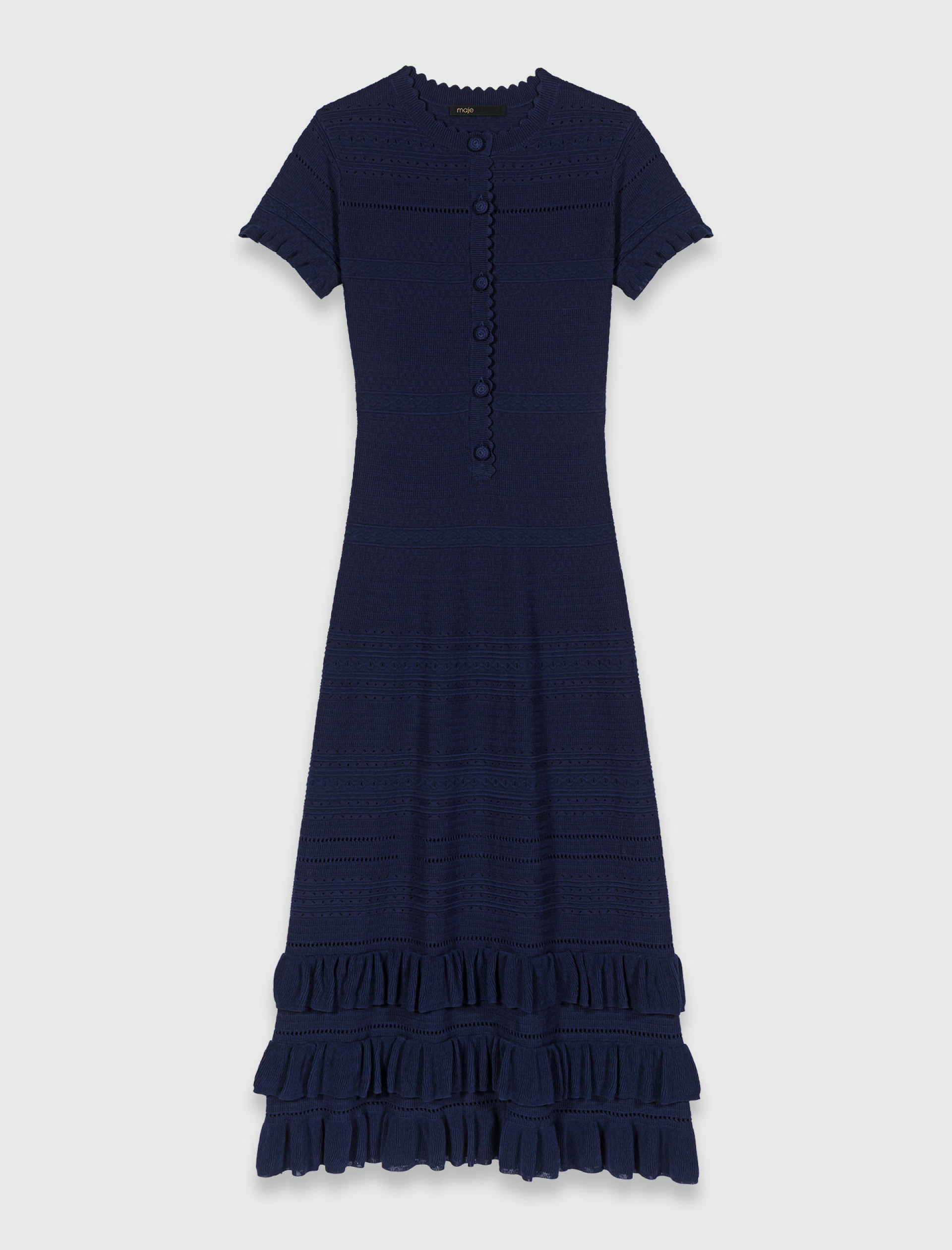 Жіноча довга в'язана сукня з оборками