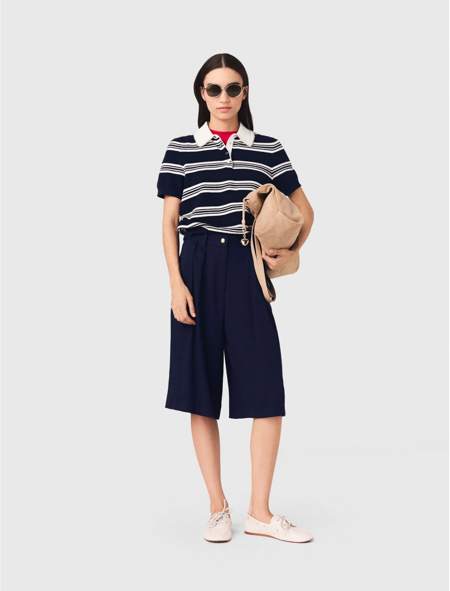 Жіноче смугасте поло зі стразами на комірі